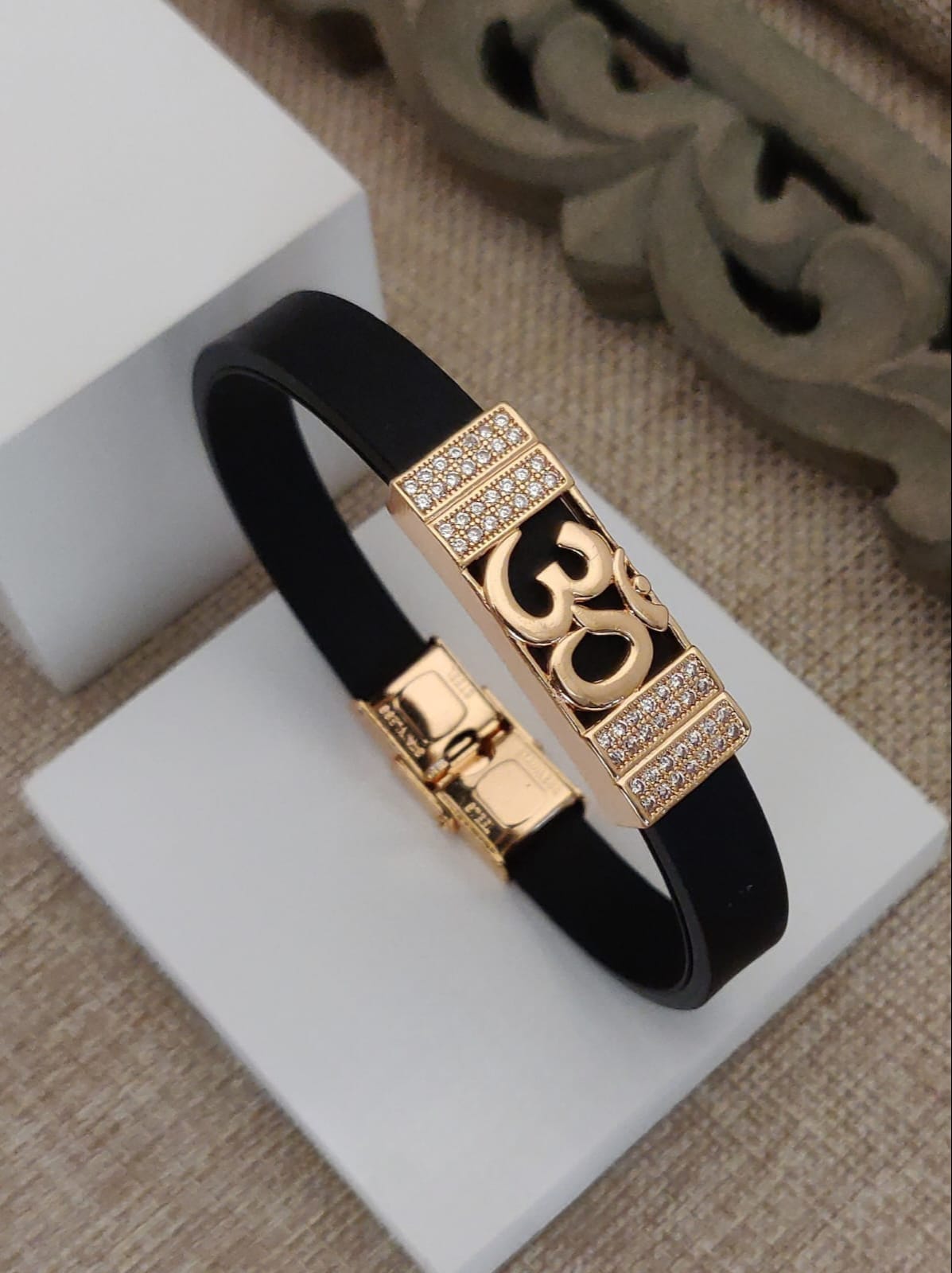 Om Gold-Plated Black Silicone Bracelet with CZ Stones
